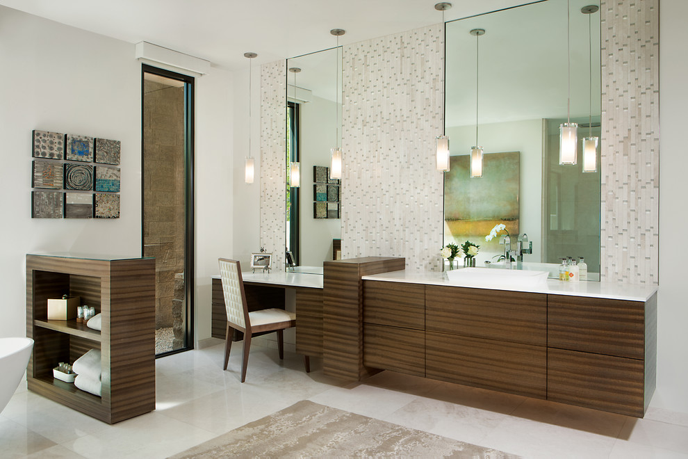Inspiration for a large contemporary ensuite bathroom in Phoenix with flat-panel cabinets, medium wood cabinets, white walls, a vessel sink, beige tiles, matchstick tiles, engineered stone worktops, a freestanding bath, a built-in shower, a one-piece toilet, marble flooring, white floors and an open shower.