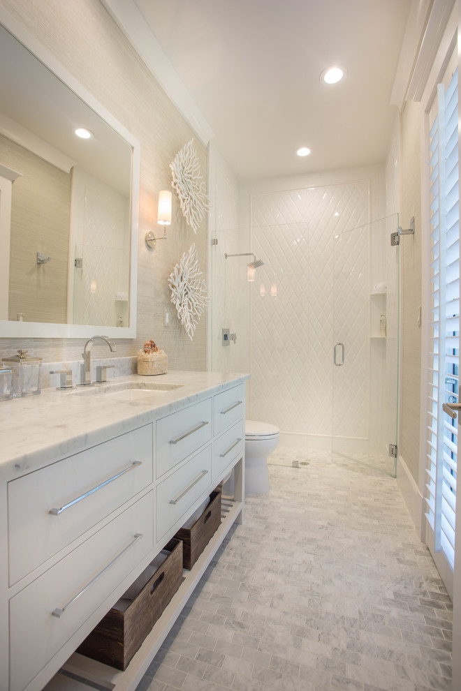 Mid-sized transitional white tile walk-in shower photo in Miami with an undermount sink, flat-panel cabinets, white cabinets and marble countertops