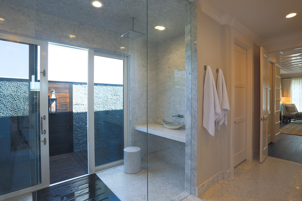 Large traditional ensuite bathroom in Miami with an integrated sink, flat-panel cabinets, white cabinets, marble worktops, a walk-in shower, a one-piece toilet, white tiles, stone tiles, white walls and mosaic tile flooring.