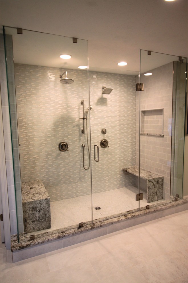 Bathroom - large transitional master white tile and mosaic tile porcelain tile and white floor bathroom idea in Indianapolis with raised-panel cabinets, dark wood cabinets, a two-piece toilet, green walls, an undermount sink, granite countertops and a hinged shower door