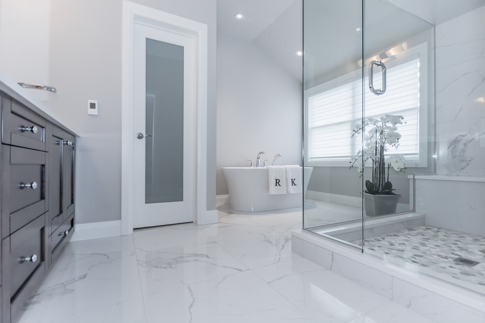 Large minimalist master porcelain tile and multicolored floor bathroom photo in Toronto with gray walls and a hinged shower door