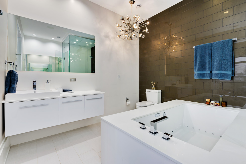 Example of a trendy 3/4 brown tile and white tile white floor bathroom design in Chicago with flat-panel cabinets, white cabinets, an undermount tub, white walls and a vessel sink