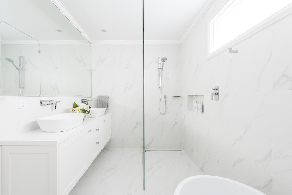 Example of a large trendy 3/4 white tile and porcelain tile porcelain tile and black floor bathroom design in Melbourne with shaker cabinets, white cabinets, white walls, a vessel sink, quartz countertops and white countertops