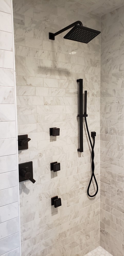 Huge elegant master white tile and porcelain tile porcelain tile and multicolored floor bathroom photo in Detroit with shaker cabinets, white cabinets, a one-piece toilet, gray walls, an undermount sink, marble countertops, a hinged shower door and white countertops
