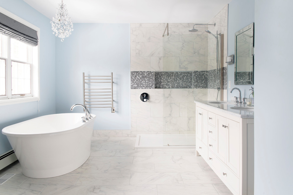 Large transitional master white tile and porcelain tile porcelain tile and white floor bathroom photo in Other with white cabinets, a one-piece toilet, blue walls, an undermount sink and marble countertops
