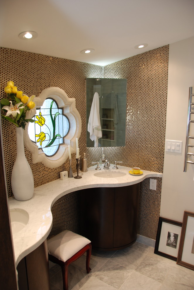 Elegant marble floor bathroom photo in Phoenix with an undermount sink, dark wood cabinets and marble countertops