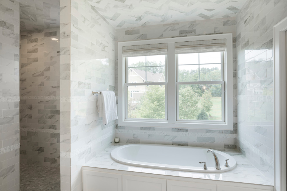Inspiration for a large traditional ensuite bathroom in Minneapolis with a built-in bath, a built-in shower, grey tiles, ceramic tiles, ceramic flooring, tiled worktops, grey floors and grey worktops.