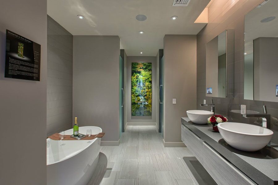 Example of a mid-sized trendy 3/4 gray tile and mosaic tile marble floor bathroom design in Los Angeles with flat-panel cabinets, gray cabinets, gray walls, a vessel sink, a two-piece toilet, quartzite countertops and a hinged shower door