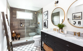 Modern farmhouse bathroom with Taupe cabinets, brass mirrors, black  lighting, brass hardware…