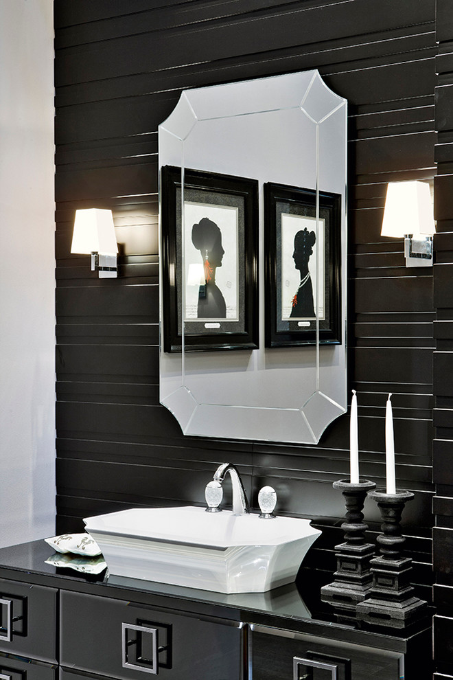 Freestanding bathtub - large contemporary master freestanding bathtub idea in New York with a vessel sink, glass-front cabinets, black cabinets and glass countertops