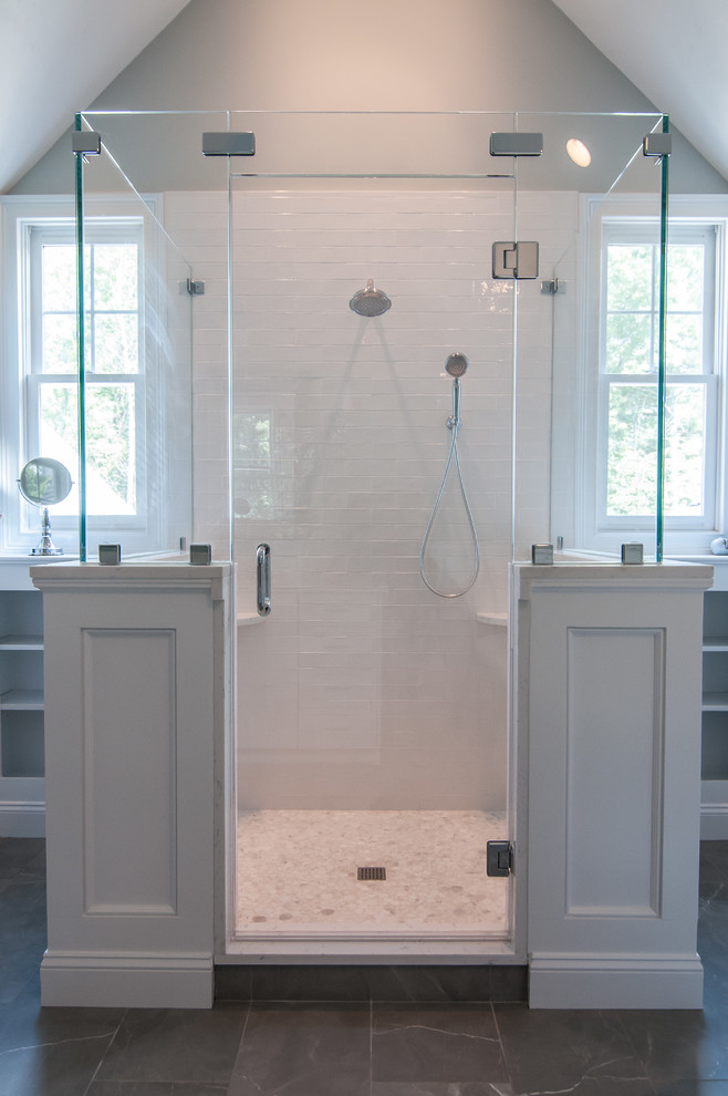 Inspiration for a large transitional master porcelain tile ceramic tile and gray floor bathroom remodel in Boston with recessed-panel cabinets, white cabinets, a two-piece toilet, gray walls, an undermount sink, quartz countertops and a hinged shower door