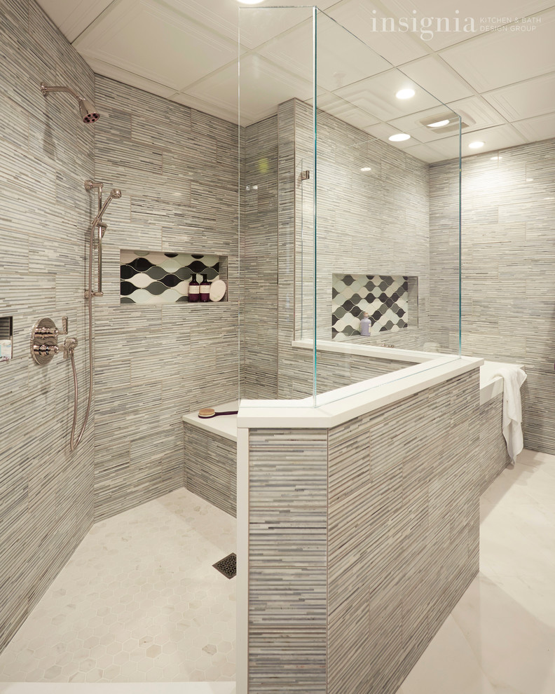 Example of a transitional master gray tile and stone tile porcelain tile drop-in bathtub design in Chicago with quartz countertops