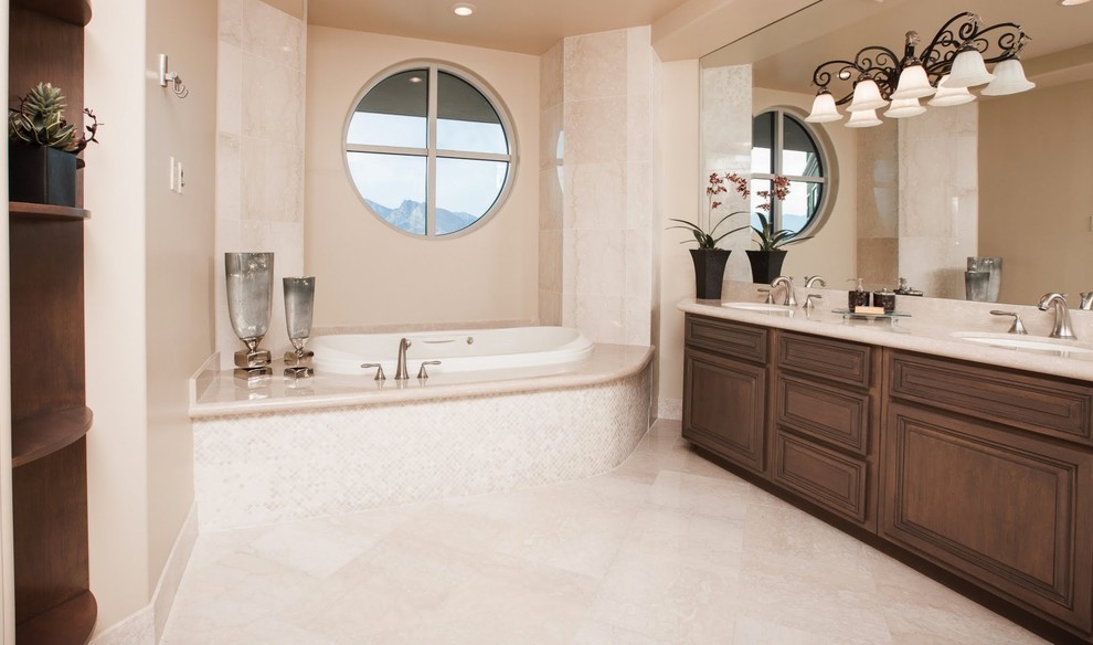Bathroom - large modern master beige tile and stone slab marble floor bathroom idea in Las Vegas with a drop-in sink, dark wood cabinets, granite countertops, a hot tub, a one-piece toilet and beige walls