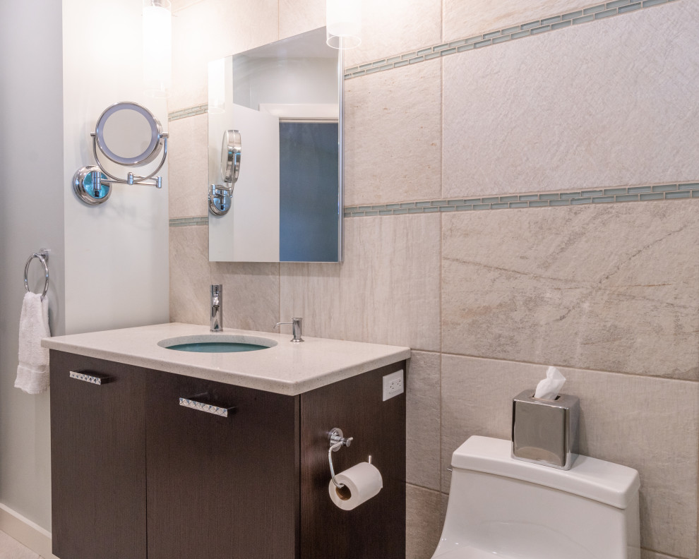 Mid-sized trendy master beige tile and ceramic tile ceramic tile, beige floor and single-sink bathroom photo in Boston with flat-panel cabinets, dark wood cabinets, beige walls, an undermount sink, quartz countertops, a hinged shower door, white countertops, a freestanding vanity and a one-piece toilet