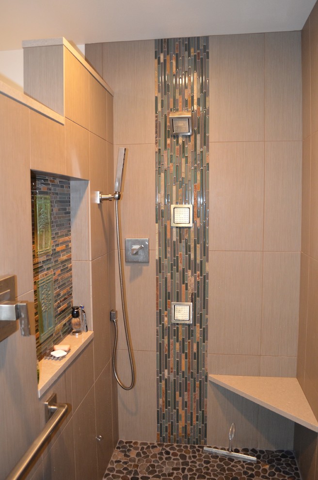 Photo of a medium sized traditional ensuite bathroom in Seattle with a vessel sink, shaker cabinets, light wood cabinets, engineered stone worktops, a walk-in shower, a two-piece toilet, beige tiles, porcelain tiles, beige walls and porcelain flooring.