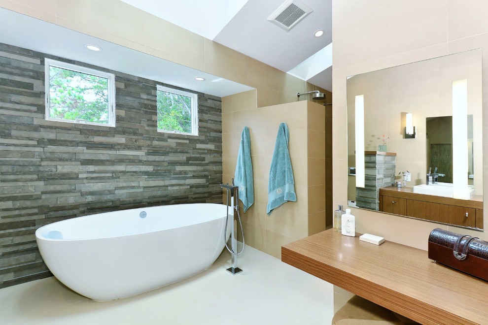 Bathroom - mid-sized contemporary master porcelain tile and beige tile porcelain tile and beige floor bathroom idea in Other with furniture-like cabinets, medium tone wood cabinets, a wall-mount toilet and wood countertops