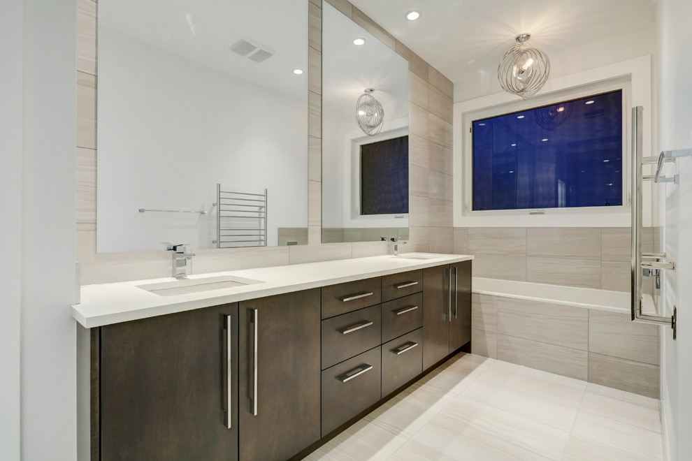 This is an example of a contemporary ensuite bathroom in Calgary with flat-panel cabinets, grey cabinets, an alcove bath, a double shower, a one-piece toilet, grey tiles, ceramic tiles, white walls, ceramic flooring, a submerged sink and quartz worktops.