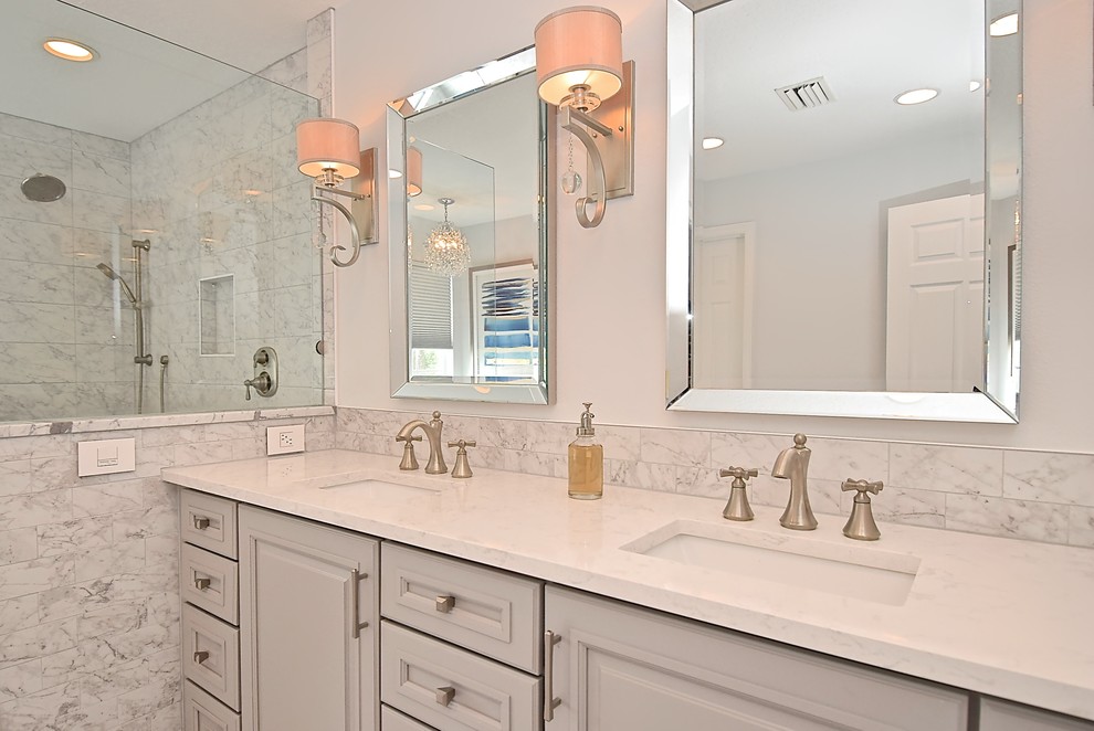Mid-sized transitional porcelain tile porcelain tile bathroom photo in Tampa with recessed-panel cabinets, an undermount sink and quartz countertops