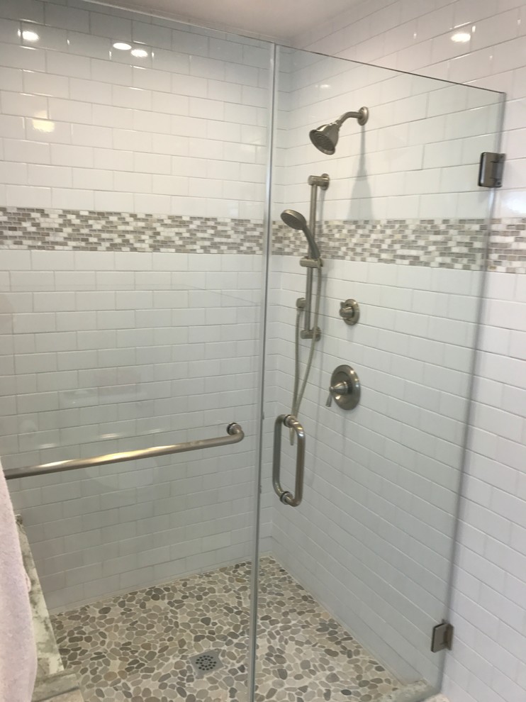Design ideas for a small contemporary ensuite bathroom in DC Metro with a corner shower, white tiles, metro tiles, white walls, pebble tile flooring, a submerged sink, beige floors and a hinged door.