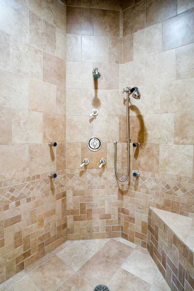 This is an example of a medium sized traditional shower room bathroom in Chicago with a corner shower, beige tiles, travertine tiles and beige walls.