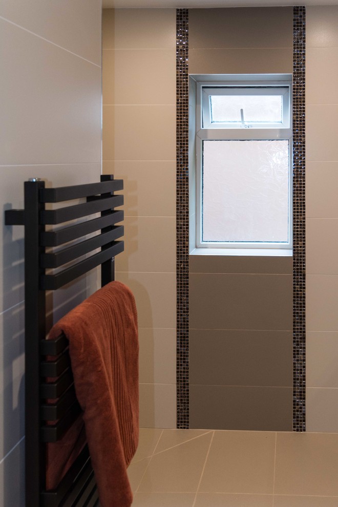 Medium sized contemporary bathroom in Manchester with a wall mounted toilet, multi-coloured tiles, porcelain tiles, multi-coloured walls, porcelain flooring, a built-in sink, multi-coloured floors and an open shower.