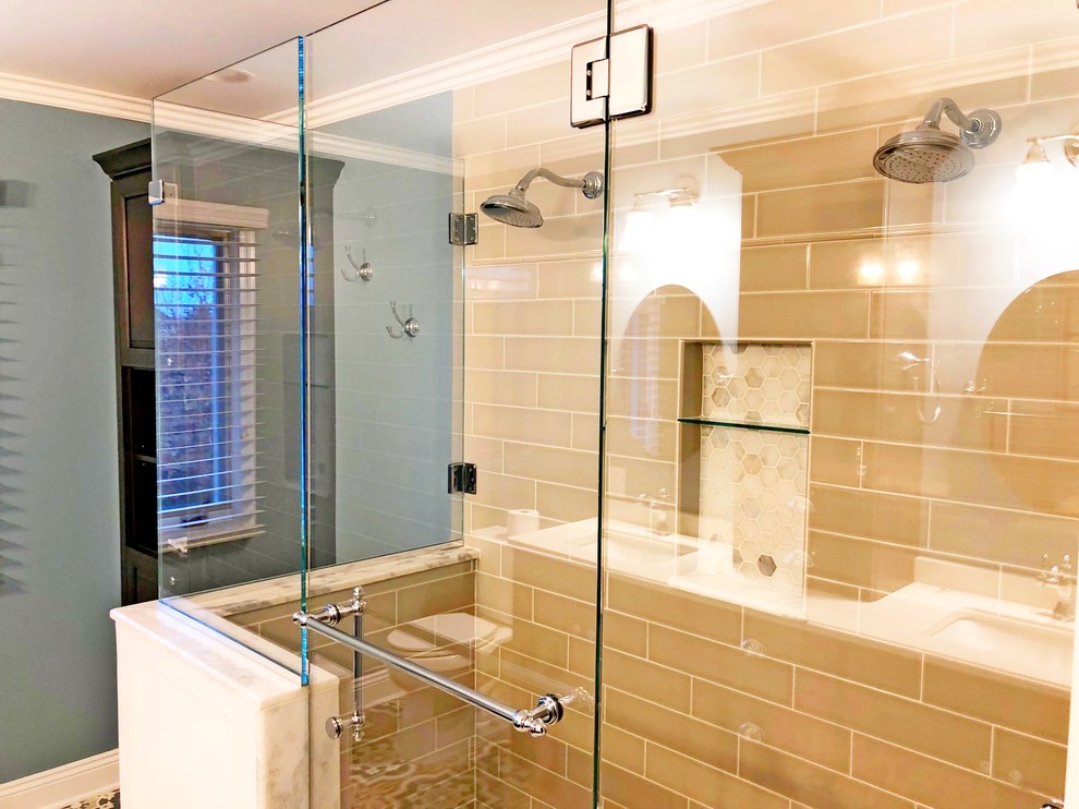 Example of a large minimalist master beige tile and subway tile ceramic tile, beige floor and double-sink double shower design in Detroit with dark wood cabinets, a two-piece toilet, blue walls, an undermount sink, wood countertops, a hinged shower door, white countertops, raised-panel cabinets, a niche and a built-in vanity