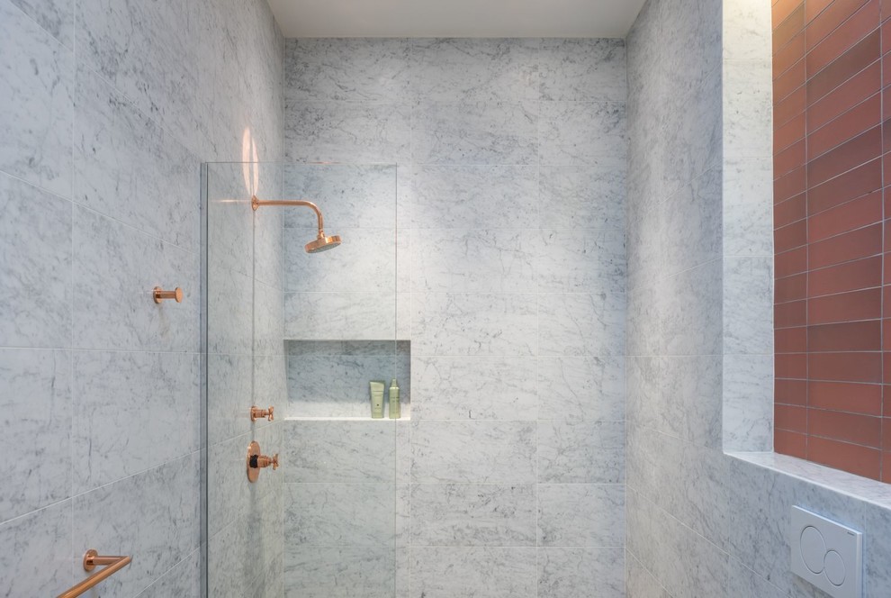 Inspiration for a mid-sized contemporary master white tile, gray tile and marble tile bathroom remodel in New York with a wall-mount toilet, a trough sink and white walls