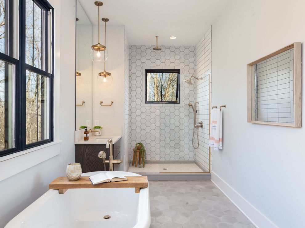 Mid-sized country master gray tile and marble tile cement tile floor and gray floor bathroom photo in Other with flat-panel cabinets, dark wood cabinets, gray walls, an undermount sink, marble countertops, a hinged shower door and white countertops