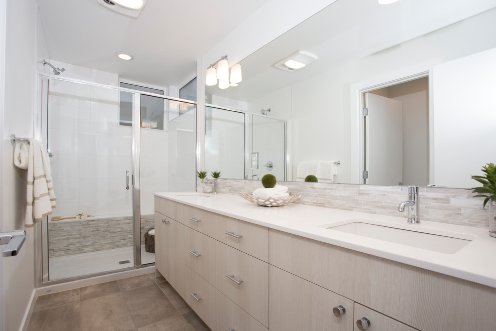 Mid-sized transitional master white tile and ceramic tile porcelain tile and beige floor alcove shower photo in Seattle with flat-panel cabinets, light wood cabinets, a two-piece toilet, white walls, an undermount sink, quartz countertops and a hinged shower door