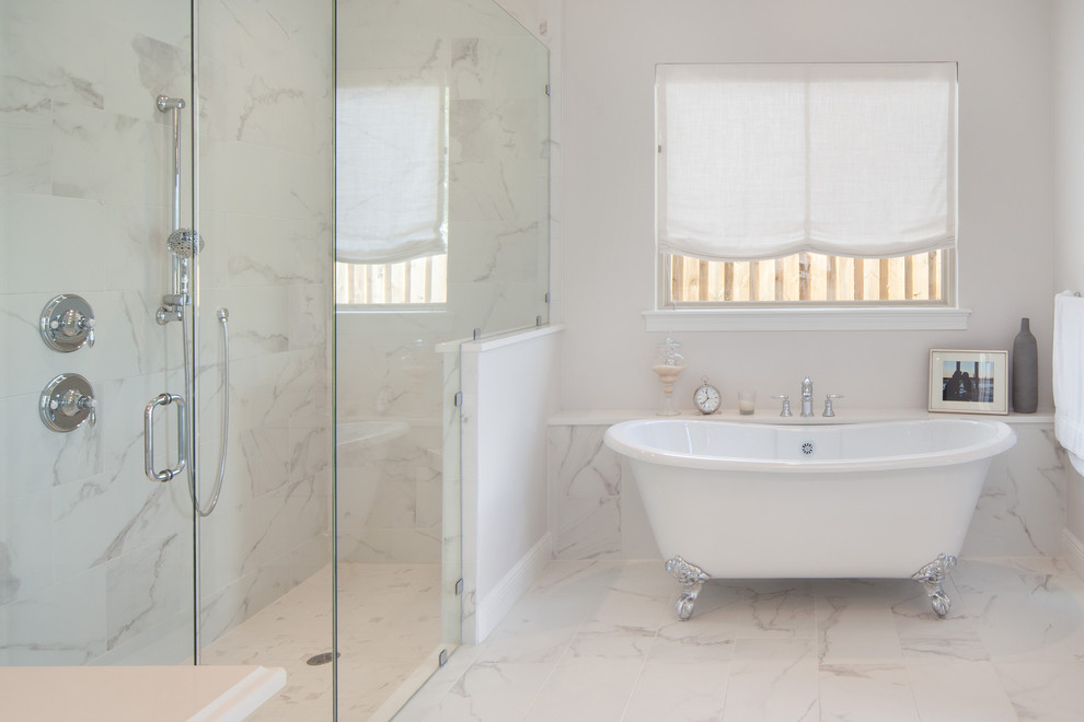 Inspiration for a large classic ensuite bathroom in Orlando with a submerged sink, flat-panel cabinets, white cabinets, quartz worktops, a claw-foot bath, a corner shower, a one-piece toilet, white tiles, porcelain tiles, grey walls and porcelain flooring.