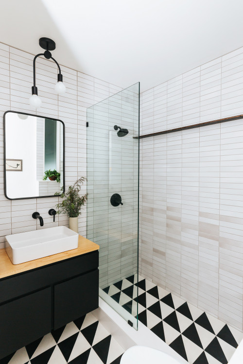 Ebony Elegance: Very Small Bathroom Ideas with a Black Vanity, a Wood Countertop, and a White Vessel Sink