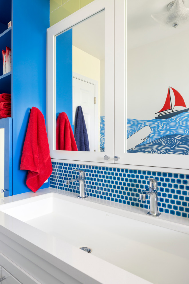 Mid-sized beach style kids' blue tile bathroom photo in Seattle with white cabinets, a drop-in sink, quartzite countertops and blue walls