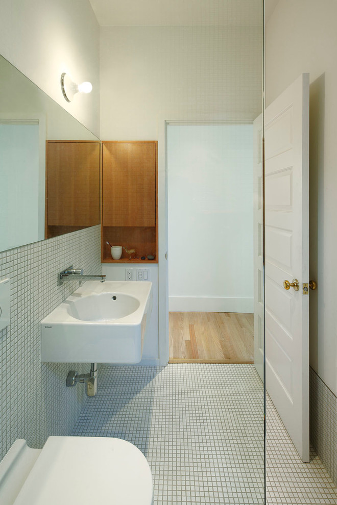 Inspiration for a mid-sized contemporary 3/4 white tile and mosaic tile mosaic tile floor and white floor bathroom remodel in Seattle with a wall-mount toilet, white walls and a wall-mount sink