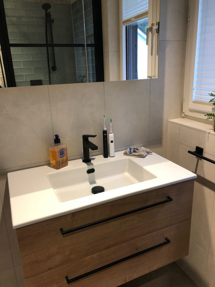Photo of a medium sized eclectic ensuite bathroom in Berkshire with medium wood cabinets, a built-in bath, a corner shower, a wall mounted toilet, multi-coloured tiles, porcelain tiles, multi-coloured walls, porcelain flooring, an integrated sink, beige floors, a single sink and a floating vanity unit.