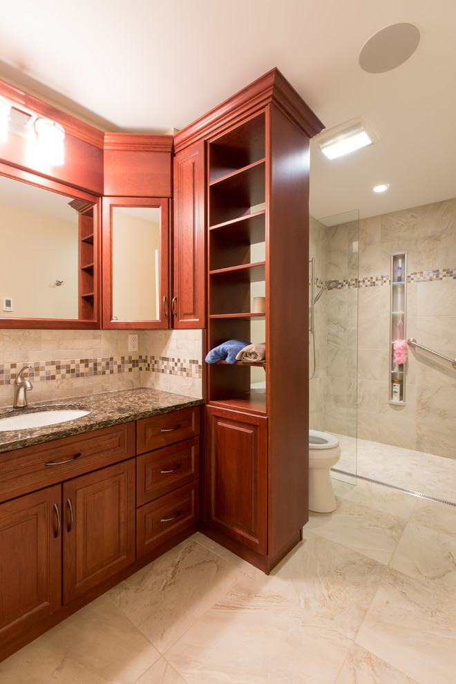 Mid-sized elegant ceramic tile bathroom photo in Edmonton with raised-panel cabinets, medium tone wood cabinets, a one-piece toilet and a drop-in sink