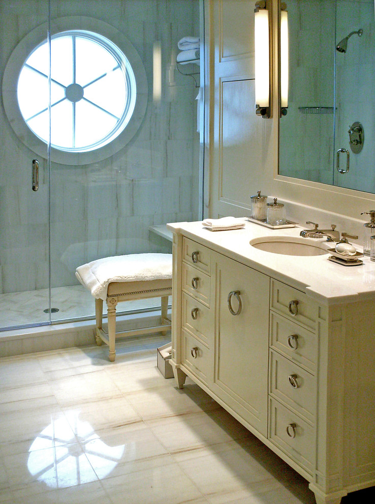 Photo of a medium sized contemporary ensuite bathroom in Philadelphia with a submerged sink, freestanding cabinets, white cabinets, marble worktops, an alcove shower, a two-piece toilet, white tiles, stone tiles, white walls and marble flooring.