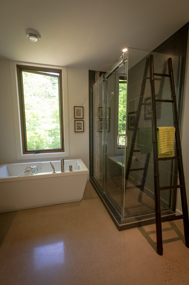 Medium sized contemporary bathroom in Montreal with a freestanding bath, a corner shower, beige tiles and white walls.
