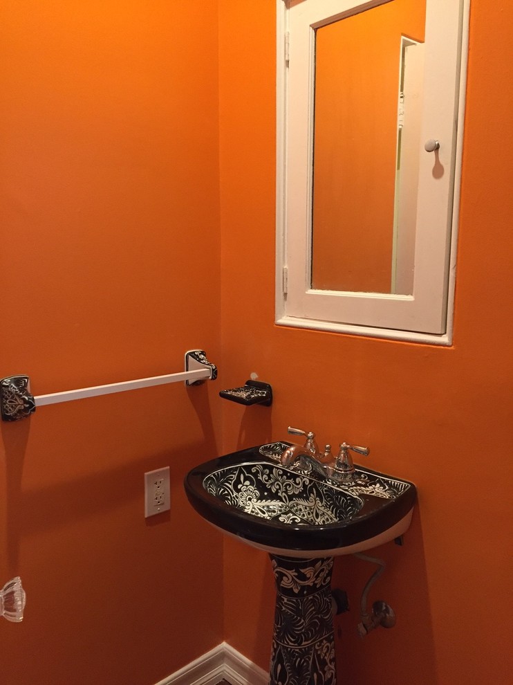 Mid-sized eclectic 3/4 white tile and ceramic tile dark wood floor alcove shower photo in Los Angeles with a two-piece toilet, orange walls and a pedestal sink