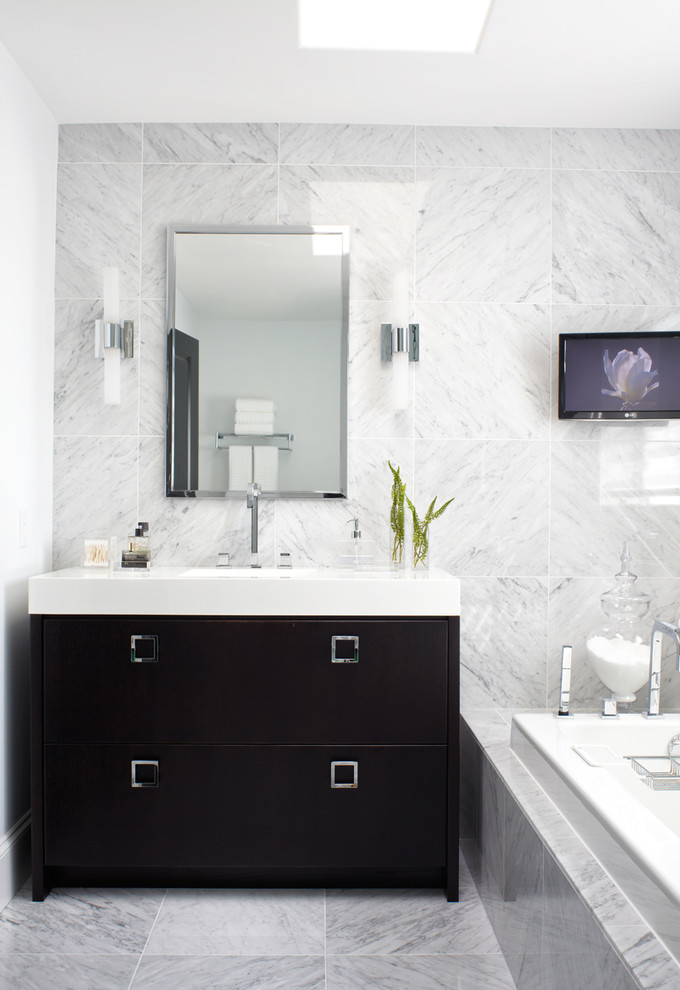 Inspiration for a contemporary drop-in bathtub remodel in Other