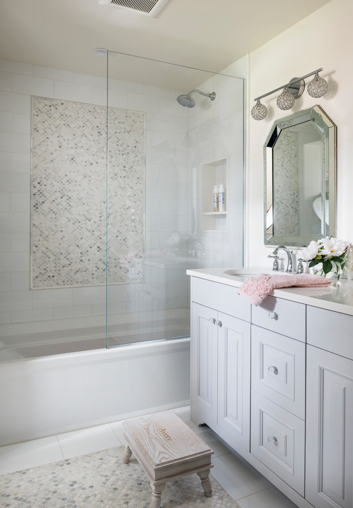 Photo of a classic bathroom in New York with raised-panel cabinets, white cabinets, an alcove bath, a shower/bath combination, beige walls, a submerged sink, white floors, an open shower and white worktops.