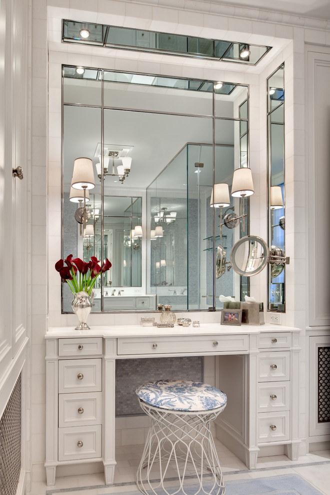This is an example of a medium sized traditional ensuite bathroom in New York with a submerged sink, white cabinets, marble worktops, an alcove shower, a two-piece toilet, blue tiles, mosaic tiles, white walls, marble flooring and recessed-panel cabinets.