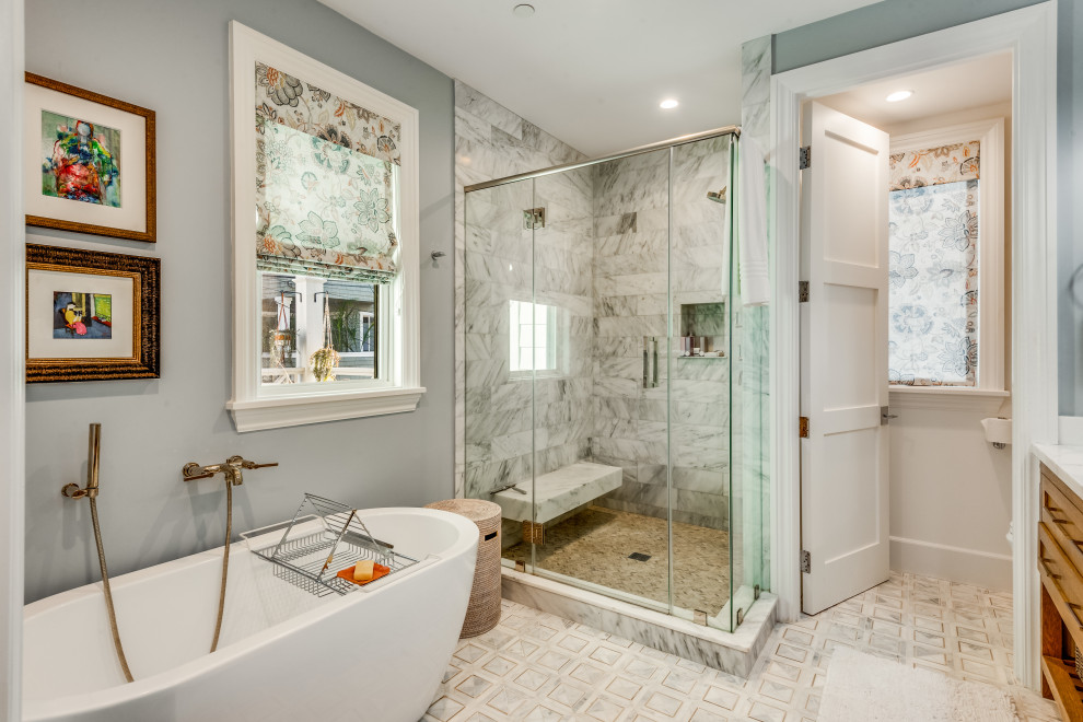 Transitional gray floor bathroom photo in Los Angeles with shaker cabinets, medium tone wood cabinets, gray walls, a hinged shower door, white countertops and a built-in vanity