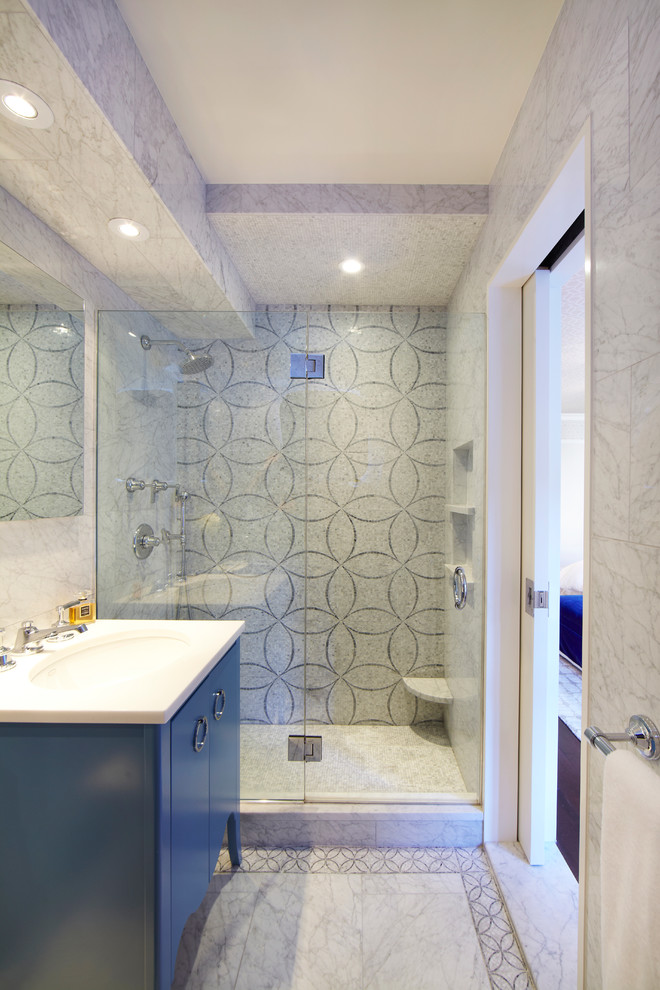 This is an example of a contemporary bathroom in New York with an alcove shower.