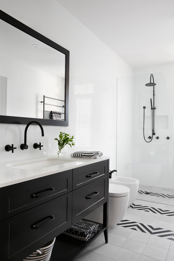 Design ideas for a large classic ensuite bathroom in Melbourne with raised-panel cabinets, black cabinets, a walk-in shower, a wall mounted toilet, white tiles, ceramic tiles, white walls, mosaic tile flooring, an integrated sink, laminate worktops, a hinged door and white worktops.