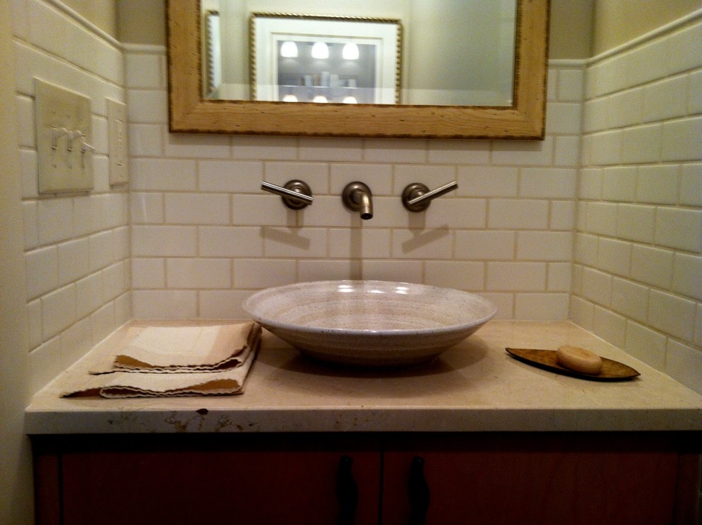 Example of a minimalist bathroom design in New York with a vessel sink