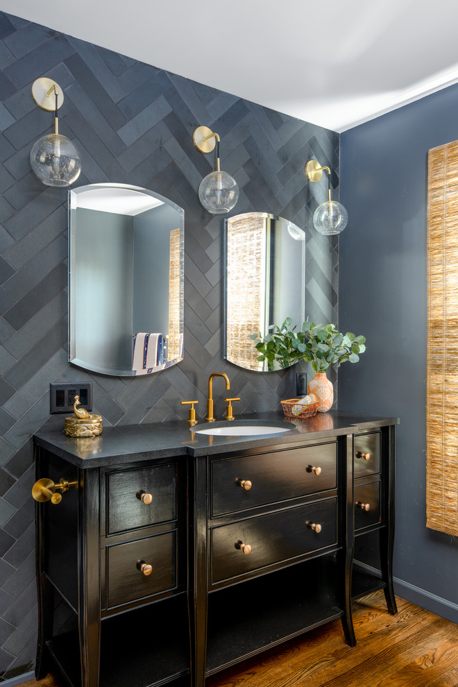 Corner shower - mid-sized eclectic master black tile and ceramic tile dark wood floor and brown floor corner shower idea in Other with furniture-like cabinets, black cabinets, a two-piece toilet, an undermount sink, quartz countertops, a hinged shower door, black countertops and gray walls
