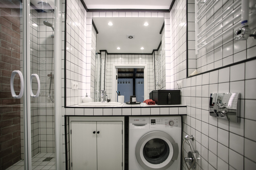 Small industrial bathroom in Moscow with a wall mounted toilet, white tiles, metro tiles, white walls, ceramic flooring, a submerged sink, tiled worktops, white floors and a hinged door.