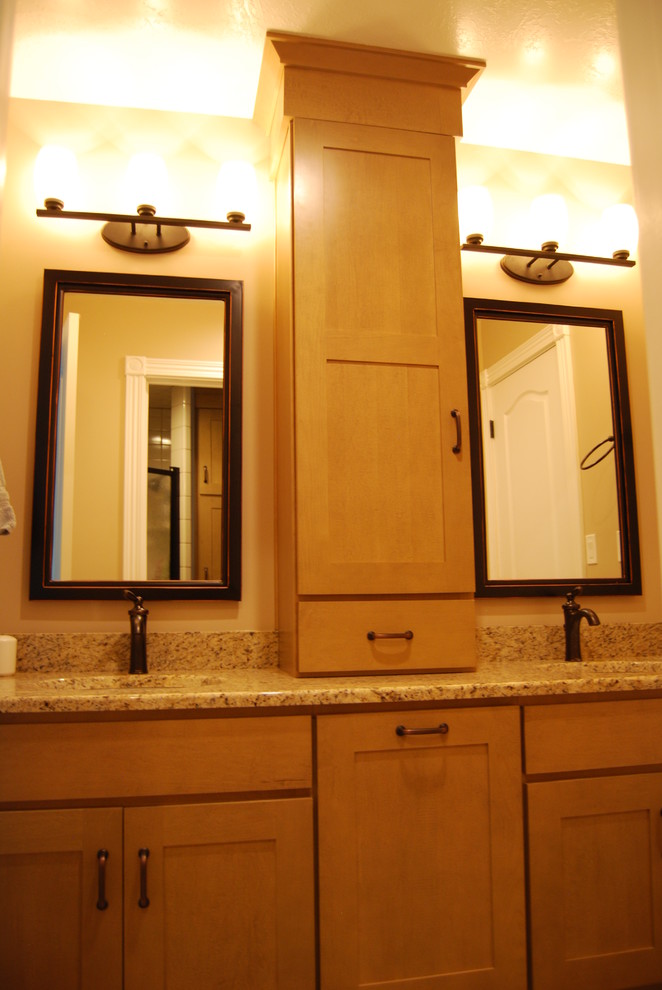 Photo of a medium sized traditional ensuite bathroom in Other with a submerged sink, light wood cabinets, granite worktops, recessed-panel cabinets, a corner shower, beige walls, a hinged door, porcelain flooring and beige floors.
