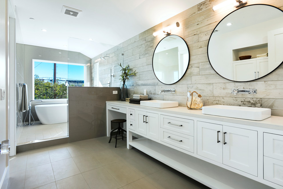 Bathroom - large coastal master porcelain tile and beige tile porcelain tile and gray floor bathroom idea in Los Angeles with shaker cabinets, white cabinets, gray walls, a drop-in sink, quartz countertops, a hinged shower door and gray countertops
