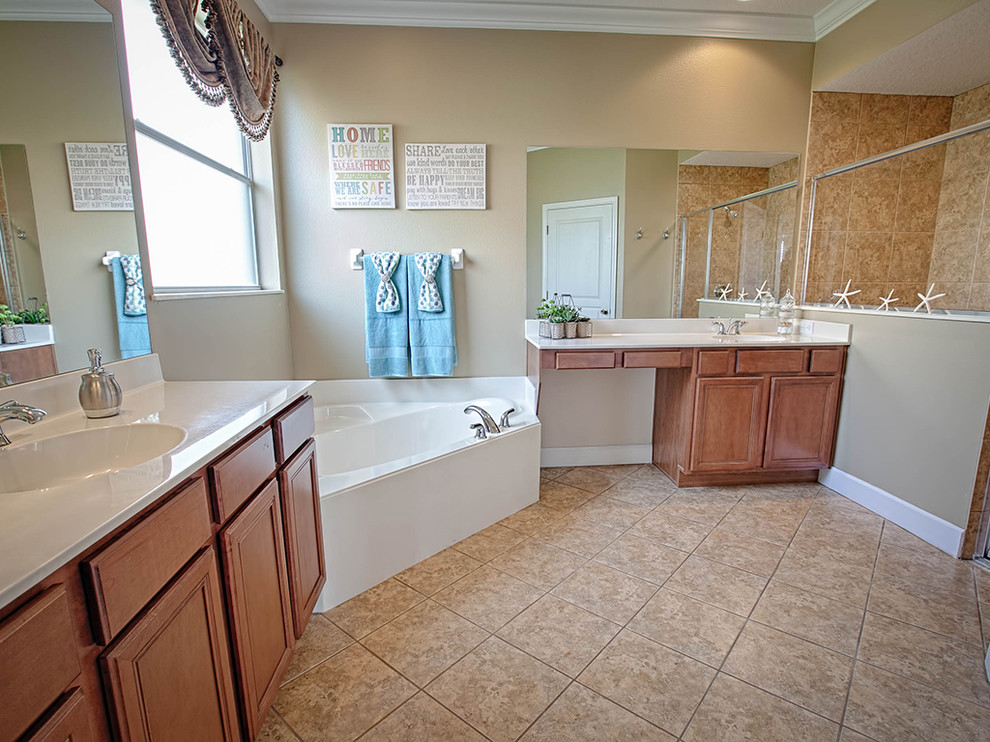 This is an example of a medium sized traditional ensuite bathroom in Orlando with raised-panel cabinets, dark wood cabinets, a built-in bath, a walk-in shower, a one-piece toilet, beige tiles, brown tiles, ceramic tiles, beige walls, travertine flooring, a submerged sink and solid surface worktops.